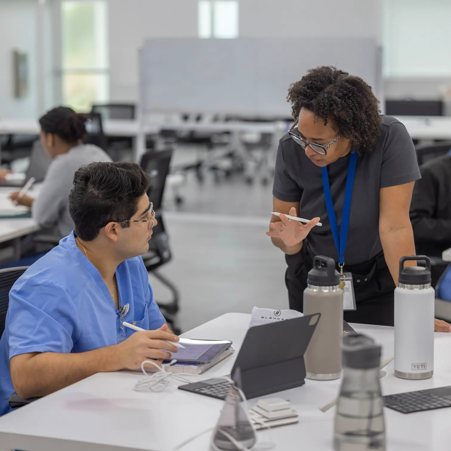 Teacher giving instruction to a medical student