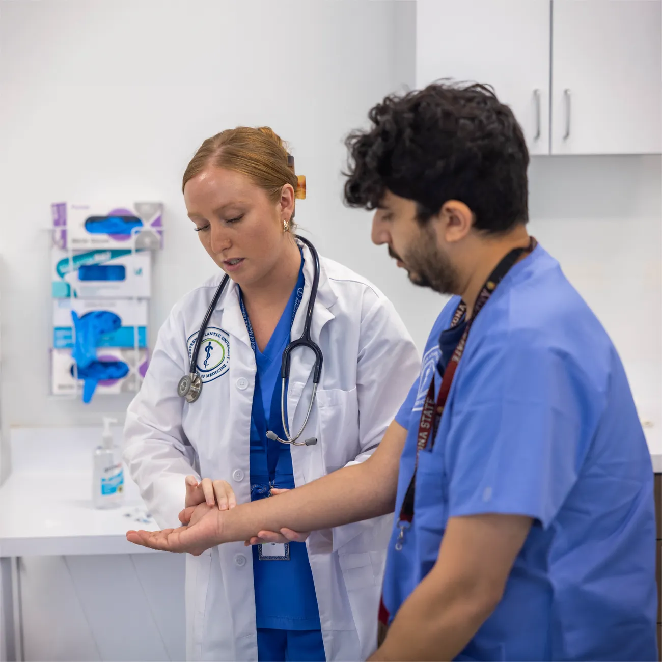 Teacher giving instruction to a medical student